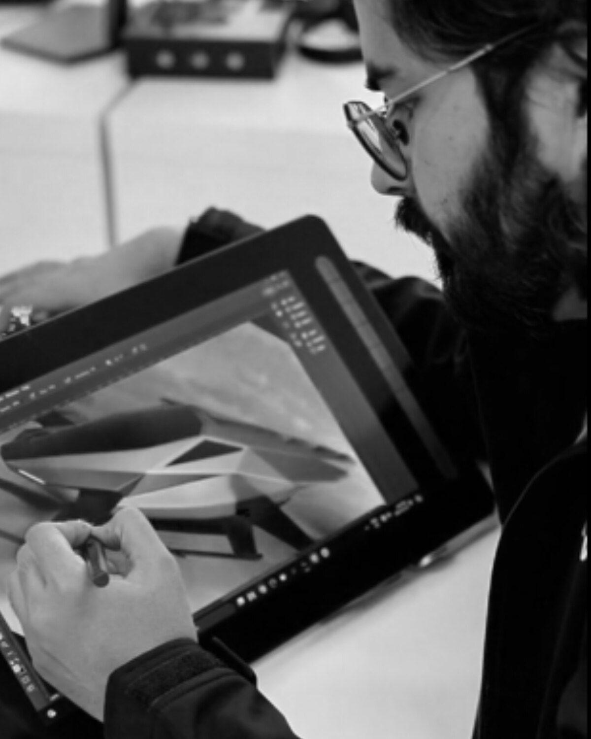 Sarthak Bhatnagar sketching at a drawing tablet